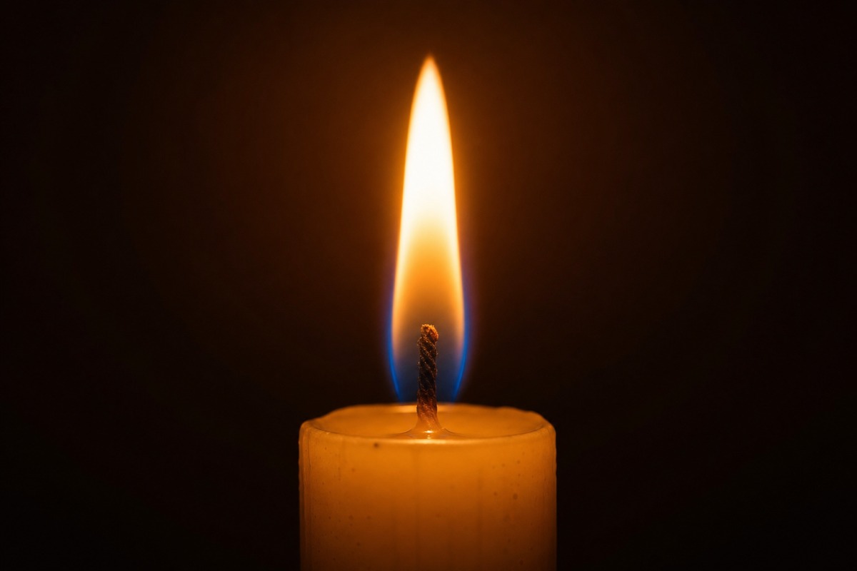 A steady, upright candle flame on a candle standing away from any draught